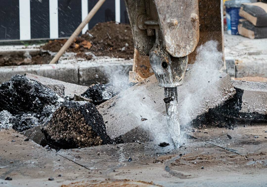 jack hammer breaking up concrete