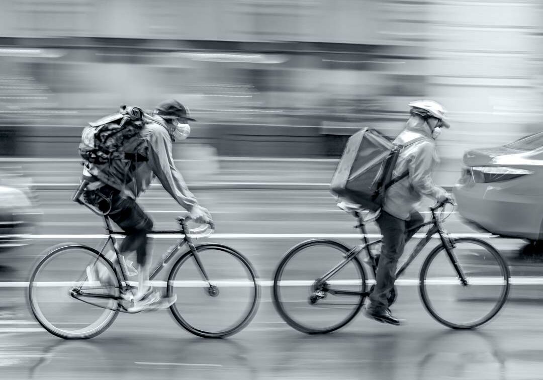 two bike riders on a blurred background